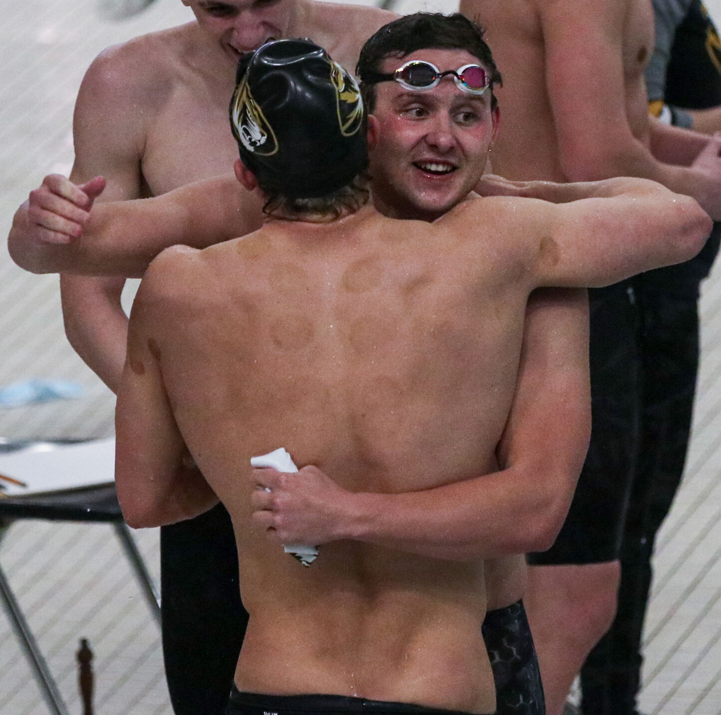 Members of the Missouri relay A-team embrace